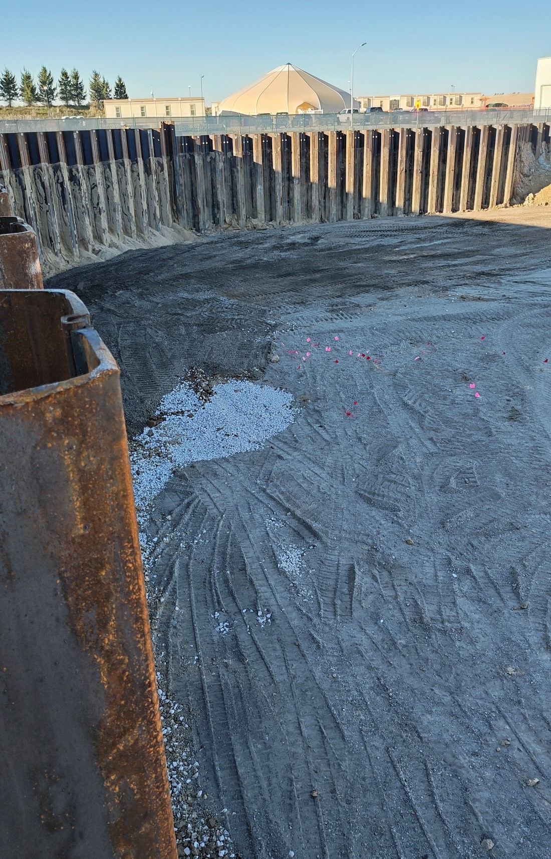 A sheet pile retaining wall