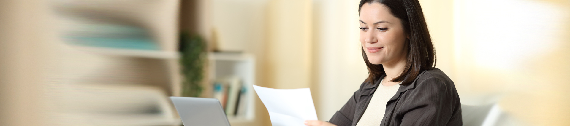 woman viewing bill laptop
