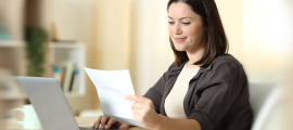 woman viewing bill laptop