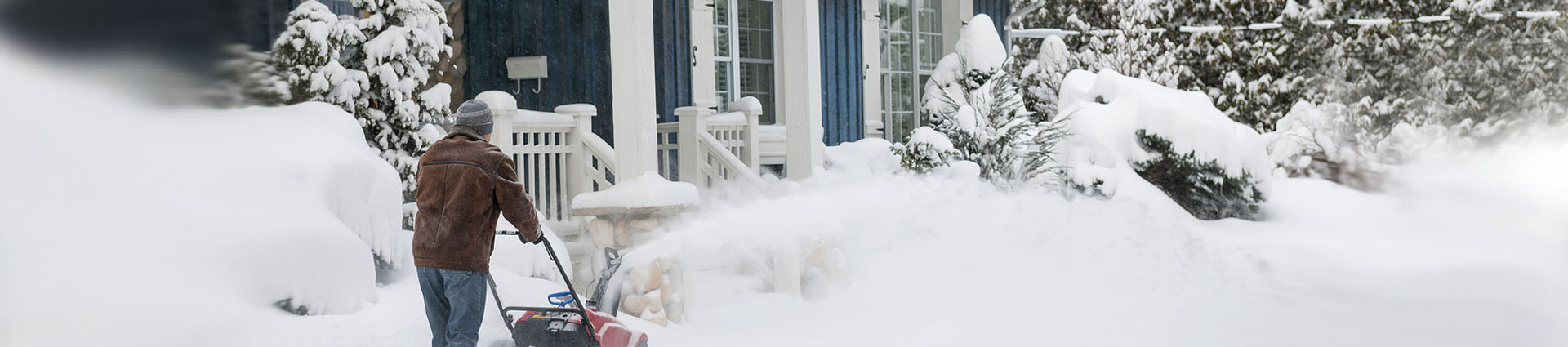 man snowblowing