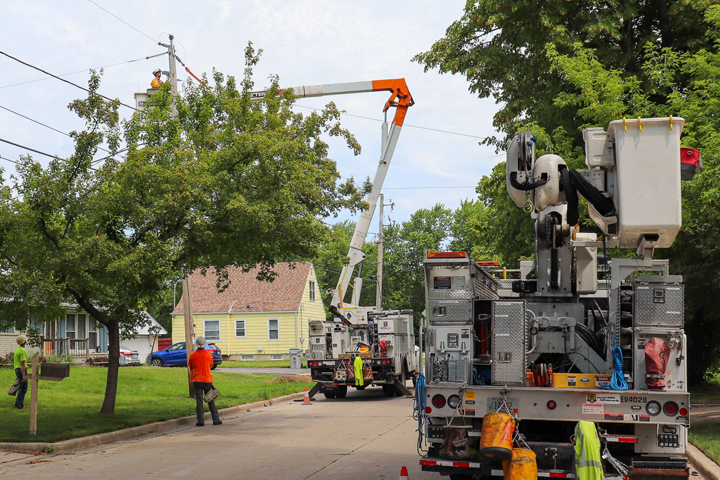 bucket truck and crew working on lines and trees